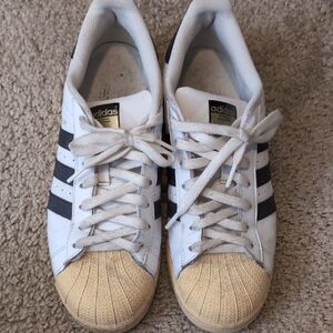Adidas White and Black Sneakers with Gold Toe